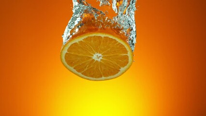 Poster - Super slow motion of falling fresh orange into water on orange gradient background. Filmed on high speed cinema camera, 1000 fps.