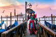 Carnevale di Venezia,Carneval .San Giorgio Maggiore  in the background,.costumes,.Venice,Veneto,Italy,Europe,