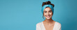 Young beautiful smiling woman in trendy headband on head isolated on flat color background with copy space. 