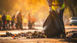 © ImageHeaven - A close-up of a young volunteer cleaning up garbage, underscoring the global pollution issue.
