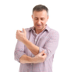 Wall Mural - Mature man rolling up his sleeve on white background