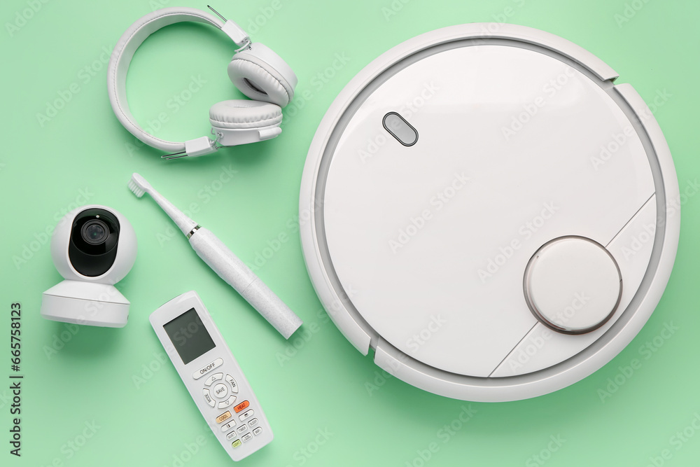 Modern gadgets on green background