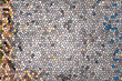 Mosaic texture with grey center, yellow left edging and slight blue right edging