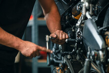Hands Of Professional Person Or Mechanic Working In Workshop Or Garage With Tools For Auto Or Bike Repair