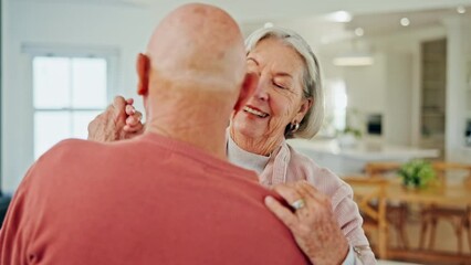 Wall Mural - Senior couple, dancing and smile in home with love, romance or bonding for wellness in retirement. Happy elderly woman, old man and together in kitchen for steps, moving and holding hands in house