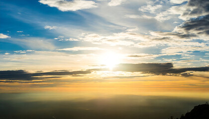 Wall Mural - cloudy sky and bright sunrise over the horizon