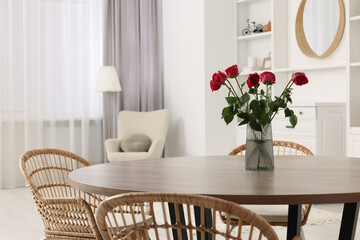 Poster - Chairs and table with vase of red rose flowers in dining room. Stylish interior