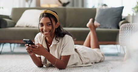 Wall Mural - Happy woman, phone and lying on living room floor for social media, communication or networking at home. Portrait of female person smile in relax on mobile smartphone for entertainment at house