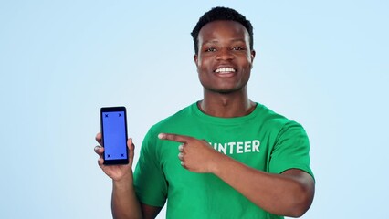 Poster - Man, volunteering and phone green screen for marketing presentation, join us or sign up to volunteer in studio. Face of African person speaking of NGO mobile mockup and contact on a blue background