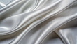 Silver silk wavy fabric abstract background close up. Closeup of rippled silk fabric. Smooth elegant silver-colored silk or satin