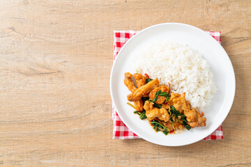 Sticker - stir-fried fried fish with basil and chili in thai style topped on rice