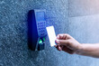 Staff holding a key card to lock and unlock door at home or condominium. using electronic card key for access. electronic key and finger scan access control system to unlock doors