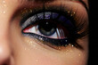 Close-up portrait of beautiful woman's eye with glitter makeup