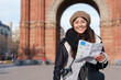 © EFStock - Portrait of young female hispanic latin tourist sightseeing Barcelona city holding city map in vacations