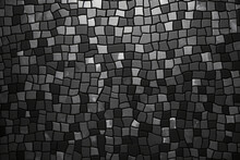 Black And Grey Mosaic Pattern Composed Of Small Rectangular Tiles Arranged In A Wave-like Formation.