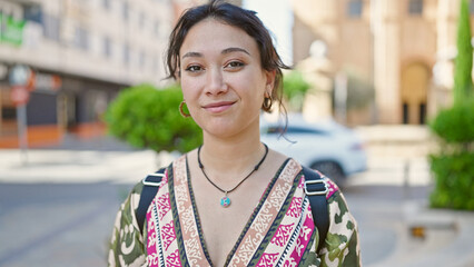 Canvas Print - Young beautiful hispanic woman smiling confident standing at street