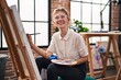 © Krakenimages.com - Young blonde woman artist smiling confident drawing at art studio