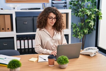 Sticker - Young hispanic woman business worker using laptop working at office