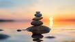 Balanced pebble pyramid silhouette on the beach on sunset. Selective focus Abstract bokeh with Sea on the background. Zen stones on the sea beach, meditation, spa, harmony, calmness, balance concept.