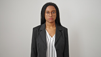 Sticker - African american woman business worker standing with serious expression over isolated white background