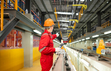 After the electric train is parked in the electric train repair shop, an electric train technician with tools inspect the railway and electric trains in accordance with the inspection round