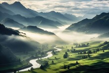 A Stunning Mountain Landscape With A Winding River Amidst Foggy Valleys At Sunrise.