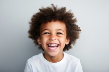 A Professional Portrait Studio Photograph Featuring An Adorable, Mixed-race Young Boy With Immaculately Clean Teeth, Radiating Joy With Laughter And Smiles. This Image Is Isolated On White Background