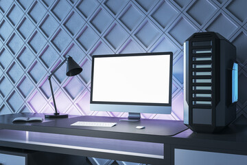 Poster - Creative gamers desktop with empty white computer screen, lamp and system unit on decorative blue wall backdrop. Gaming concept. Mock up, 3D Rendering.