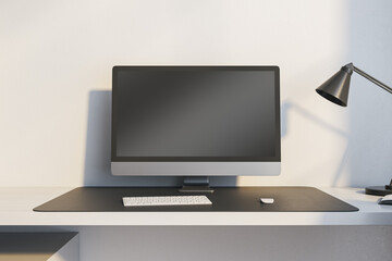 Poster - Close up of modern workplace with empty mock up computer monitor and lamp. 3D Rendering.