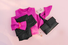 Pink Jumper With Leather Pants And Handbag On White Background. Women's Sweater Stylish Autumn Or Winter Clothes. Cozy Winter Look.  Flat Lay, Top View.