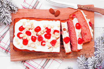Poster - Christmas cherry loaf. Overhead view table scene on a white wood background.