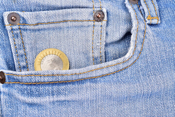 Wall Mural - Top view of indian rupee coin in jean pocket