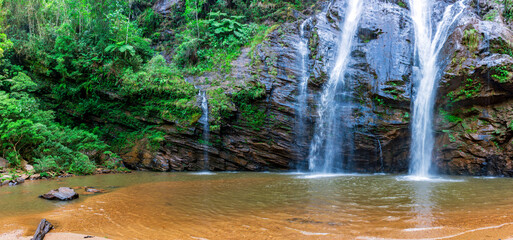 Wall Mural - Small lake formed by the waters of a waterfall embedded in the rainforest in Minas Gerais, Brazil