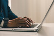 © Smallroombigdream - Businessman analyzes business data on laptop computer with smart phone, digital tablet business profits report strategy analysis concept.