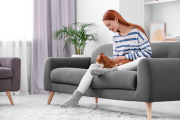 Poster - Woman with her cute cat on sofa at home