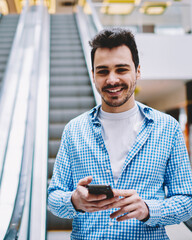 Wall Mural - half length portrait of happy smiling hipster guy in stylish shirt looking at camera