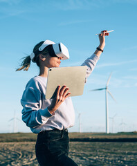 Woman creating virtual reality in open space