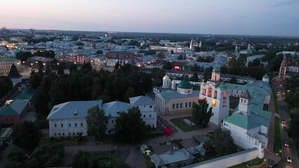 Wall Mural - Scenic aerial view of Yaroslavl cityscape on banks of Volga River overlooking architectural complex of Transfiguration monastery in summer twilight, Russia