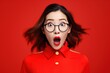 Portrait of surprised asian woman on bright colors studio backgroud, excitement and fascination, shocked and amazed female with unexpected thing happen