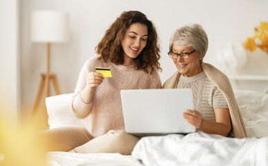 women are using laptop for online shopping