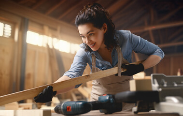 Wall Mural - carpenter is working in workshop