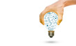 © Worawut - Light bulb by hand with business strategy
