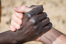 View Of A Black And White Hands Shaking In Senegal.