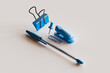 © Westend61 - 3D render of blue colored office supplies floating against white background
