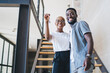 © BullRun - Cheerful black couple receiving home key
