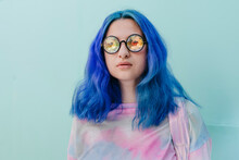 Woman With Dyed Blue Hair Wearing Kaleidoscopic Eyeglasses