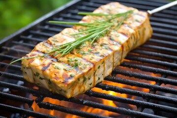 Poster - close-up of a tofu steak on a spatula over the grill