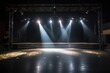 light beams on empty stage focusing on class divide