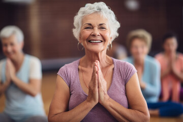 Portrait of a happy senior woman taking park in a yoga or fitness class