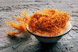 Irish sea moss, Chondrus Crispus, healthy organic raw seaweed, dried, in a bowl on a black slate background